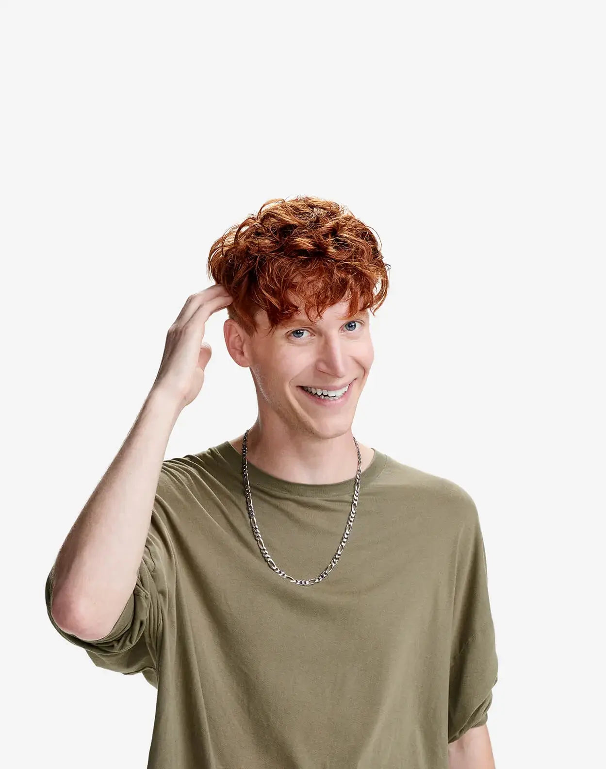 Effortless Styling Products for Curly Hair. American Crew model Pete Montzingo smiles at the camera while wearing an olive-green crew neck shirt.